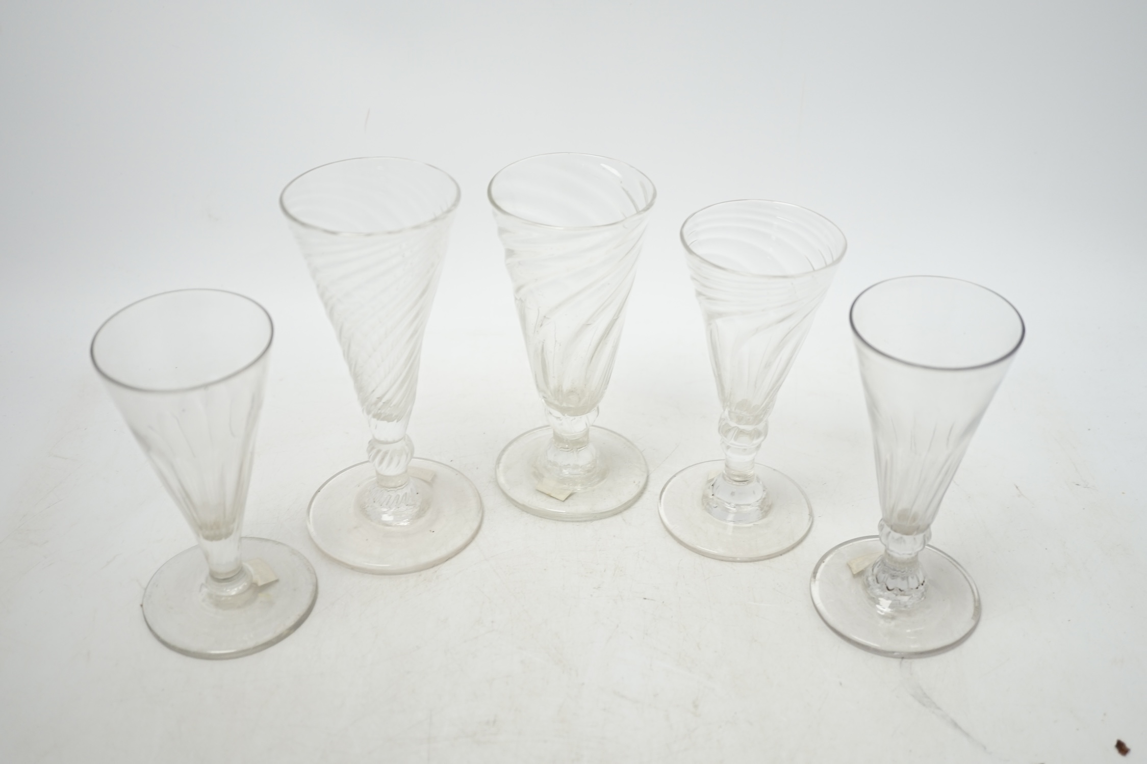 Five mid 18th century wrythen ale glasses, tallest 14.5cm. Condition - good